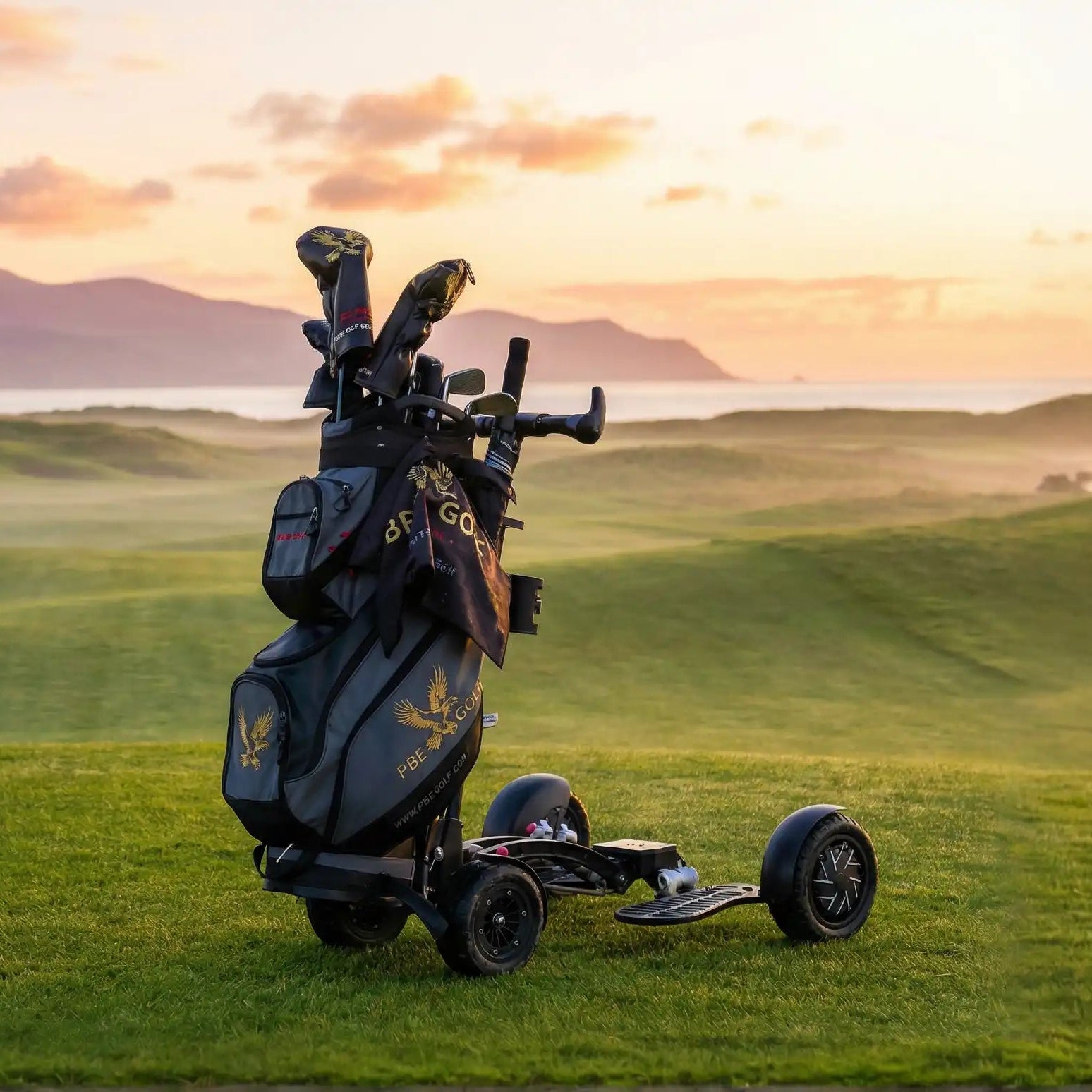 Golf bag with clubs on a golf cart in a scenic golf course at sunset.