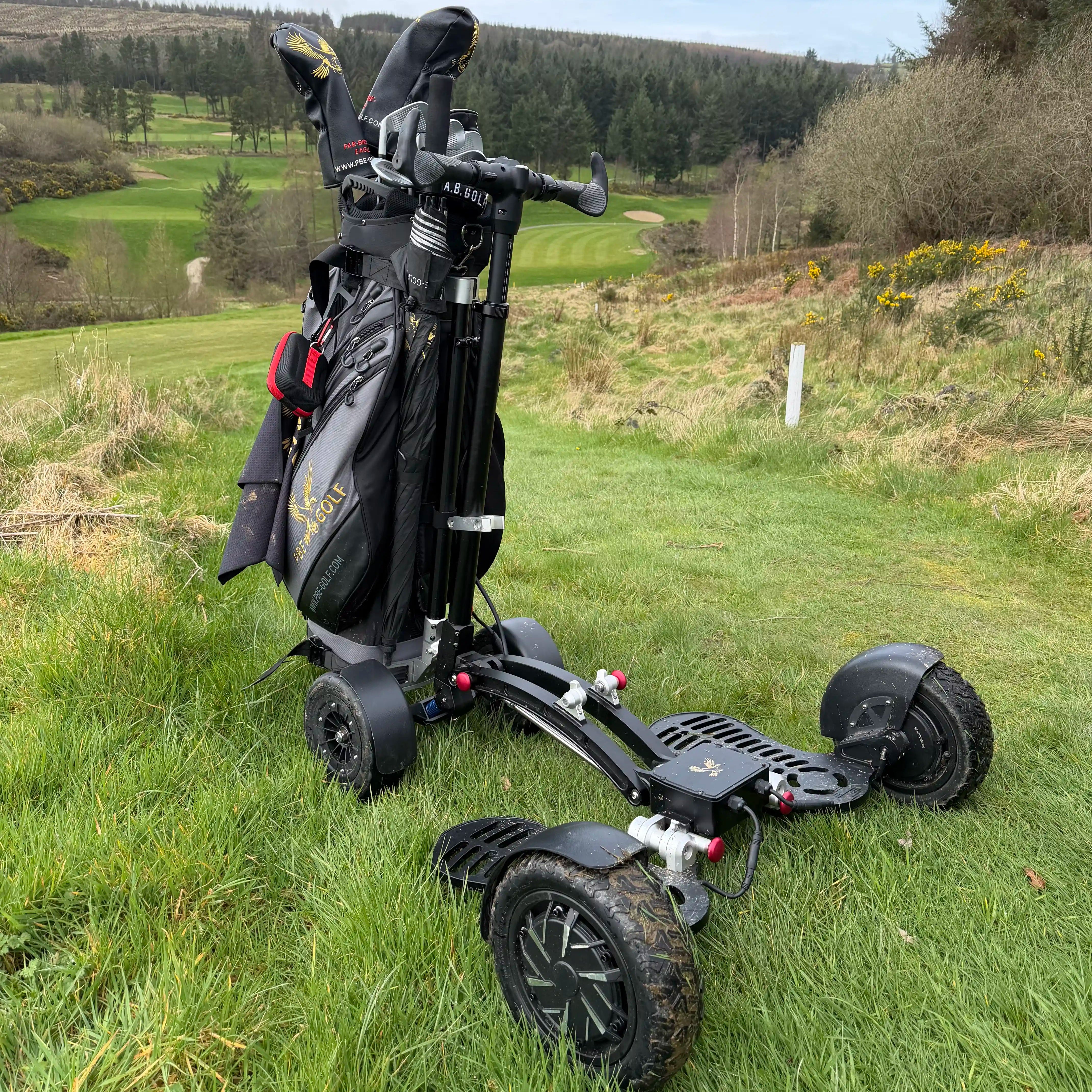 Golf trolley with clubs on a grassy golf course