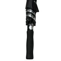 Close-up of an umbrella's black handle and silver mechanism on a white background