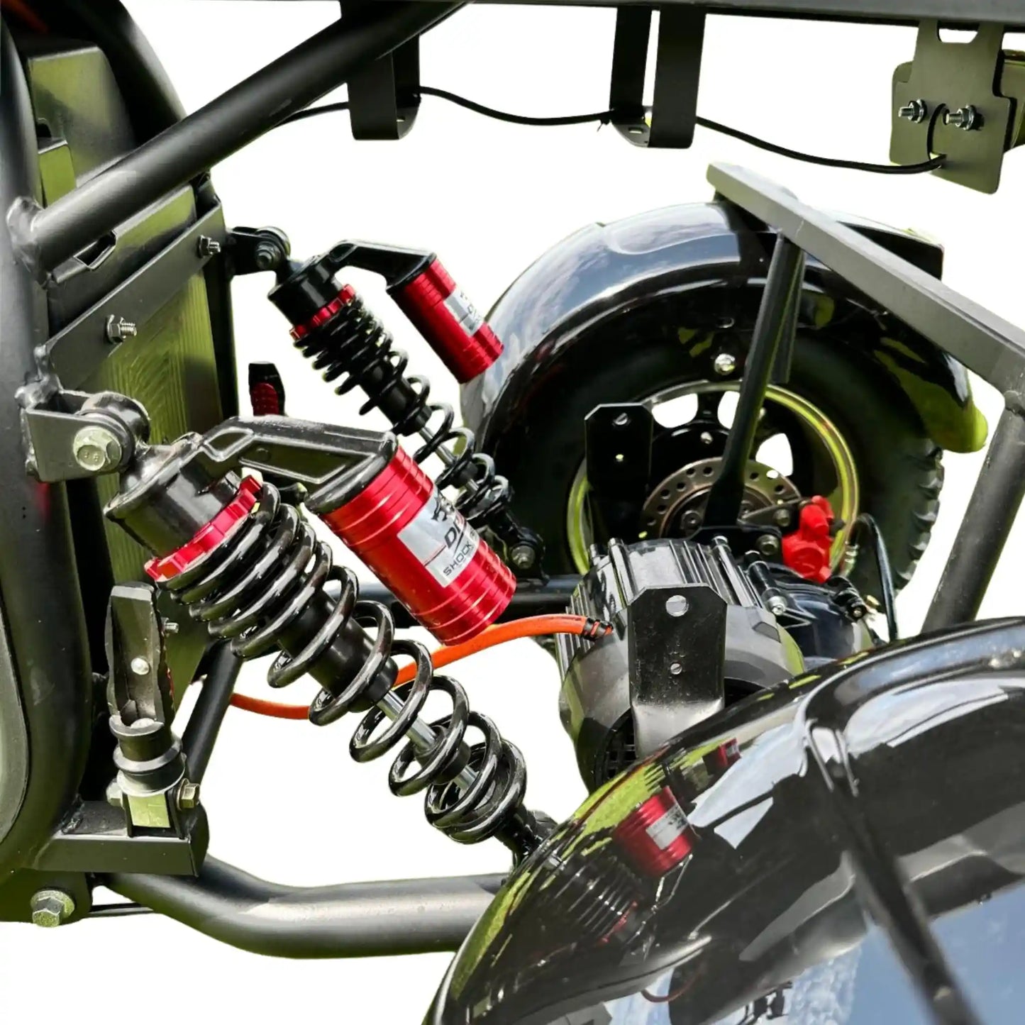 Close-up of a motorcycle suspension system with springs and shock absorbers.
