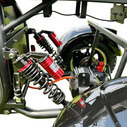 Close-up of a motorcycle suspension system with springs and shock absorbers.