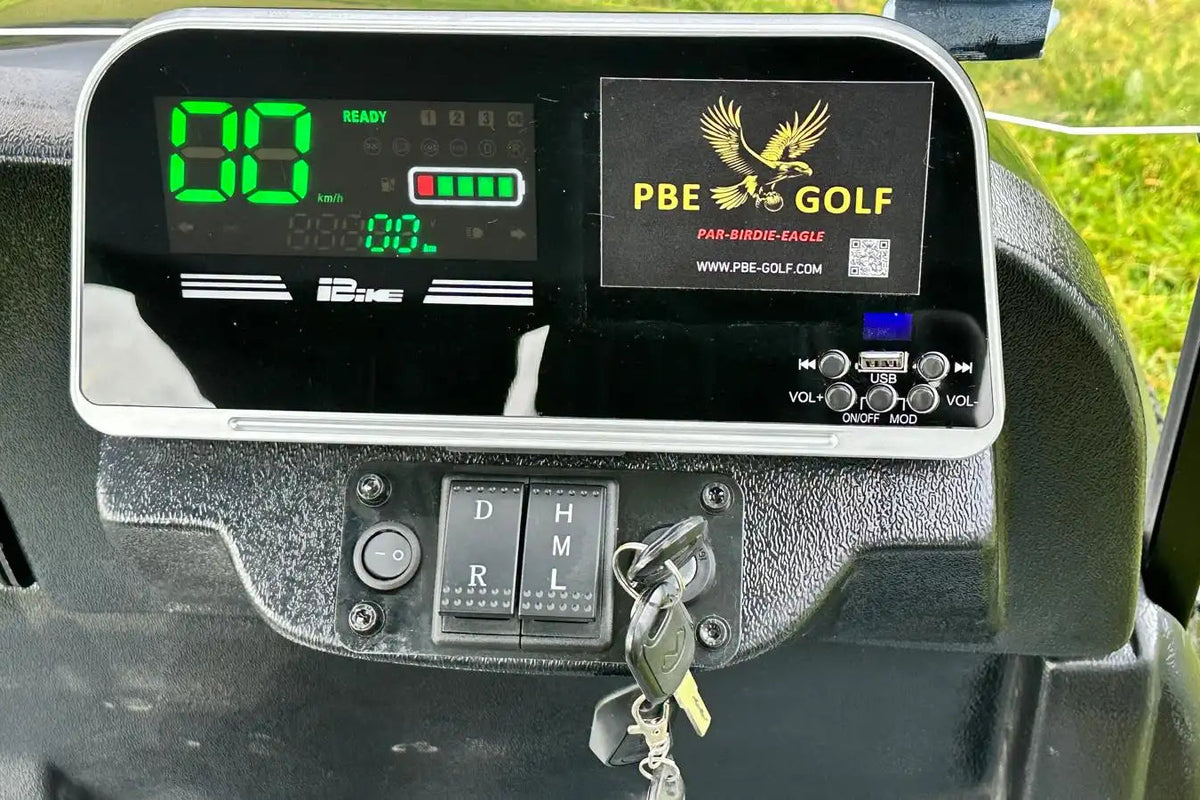 Golf cart dashboard with digital display and PBE Golf logo